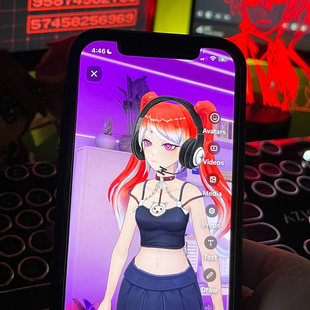 A photo of a red hair vtuber in an application in front of a pc setup