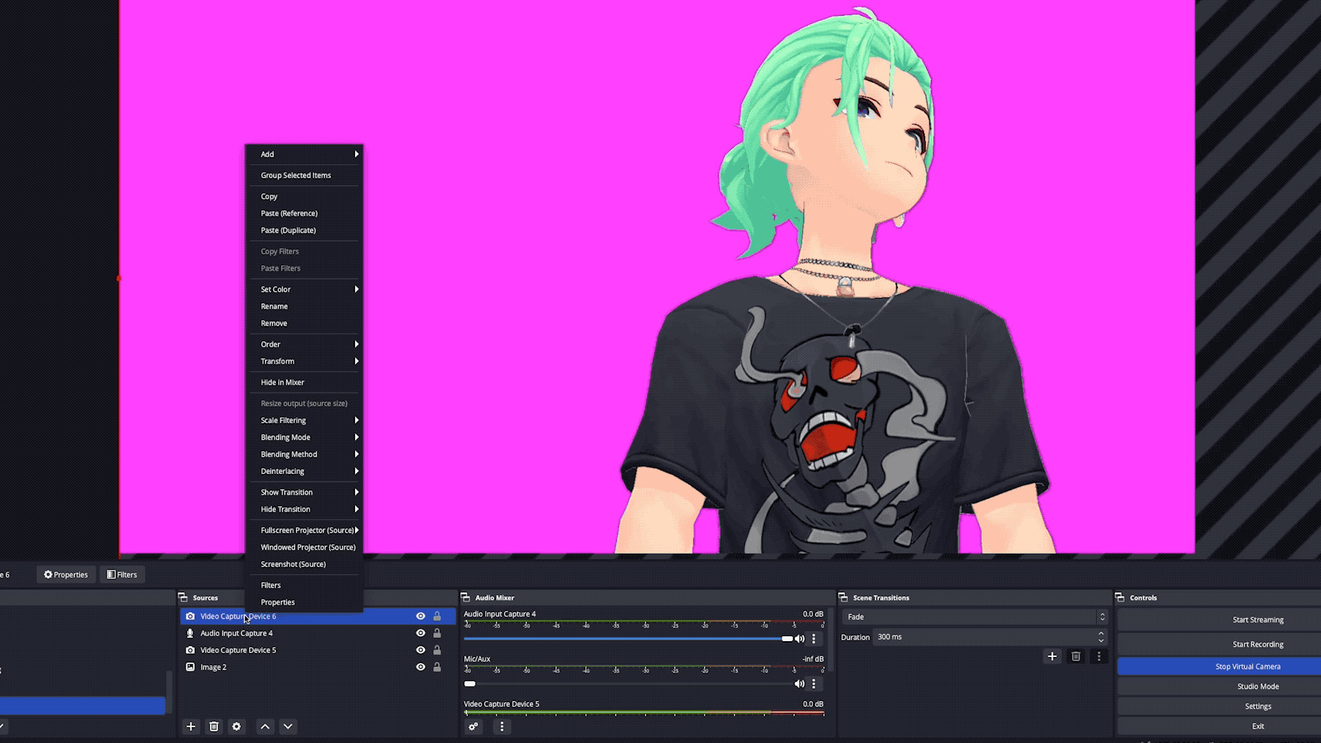 A photo of a pink hair vtuber set up on their computer